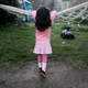 Lulu, a transgender girl, leans on a hammock at her home in Buenos Aires July 25, 2013. Lulu, a six-year-old Argentine child who was listed as a boy at birth, has been granted new identification papers by the Buenos Aires provincial government listing her as a girl. According to her mother Gabriela, Lulu chose the gender as soon as she first learned to speak. Gabriela said her child, named Manuel at birth, insisted on being called Lulu since she was just four years old, local media reported. Argentina in 2012 put in place liberal rules on changing gender, allowing people to alter their gender on official documents without first having to receive a psychiatric diagnosis or surgery. Picture taken on July 25, 2013. REUTERS/Stringer (ARGENTINA - Tags: SOCIETY HEALTH) - RTX141CN